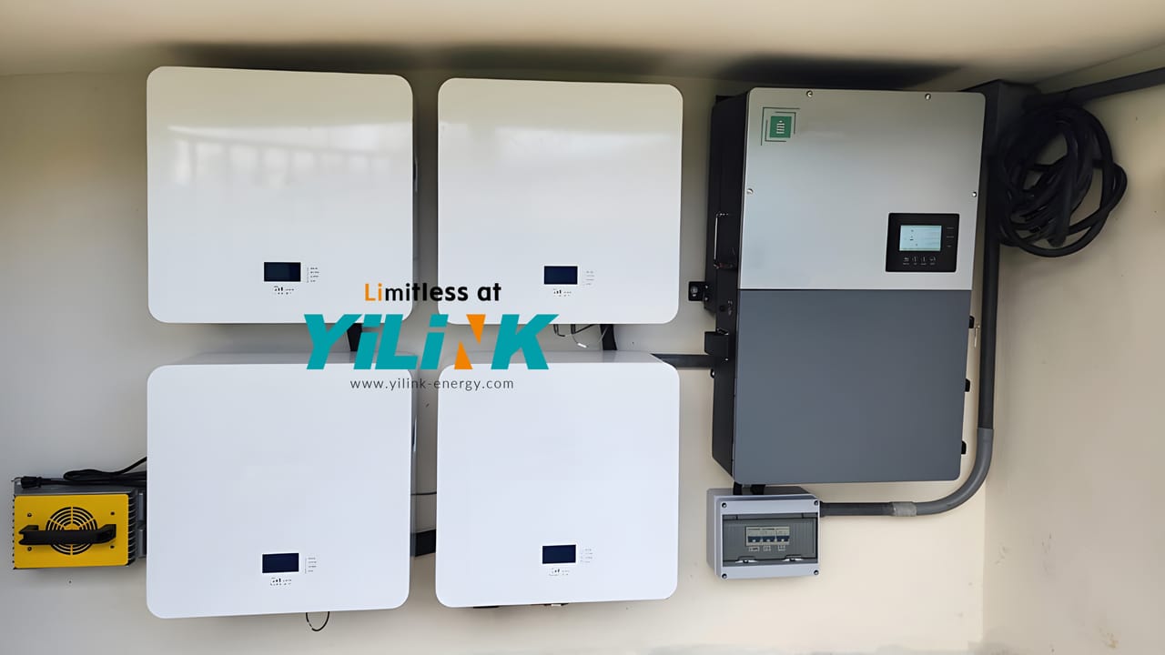 Two Yilink iPower Mini wall batteries with their hybrid inverter